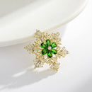 Stylishwe   クリスマス おしゃれ 回転スノー ブローチ4色選択可