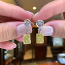 Stylishwe 6.5 carat swaying yellow sapphire drop earrings 