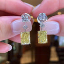Stylishwe 6.5 carat swaying yellow sapphire drop earrings 